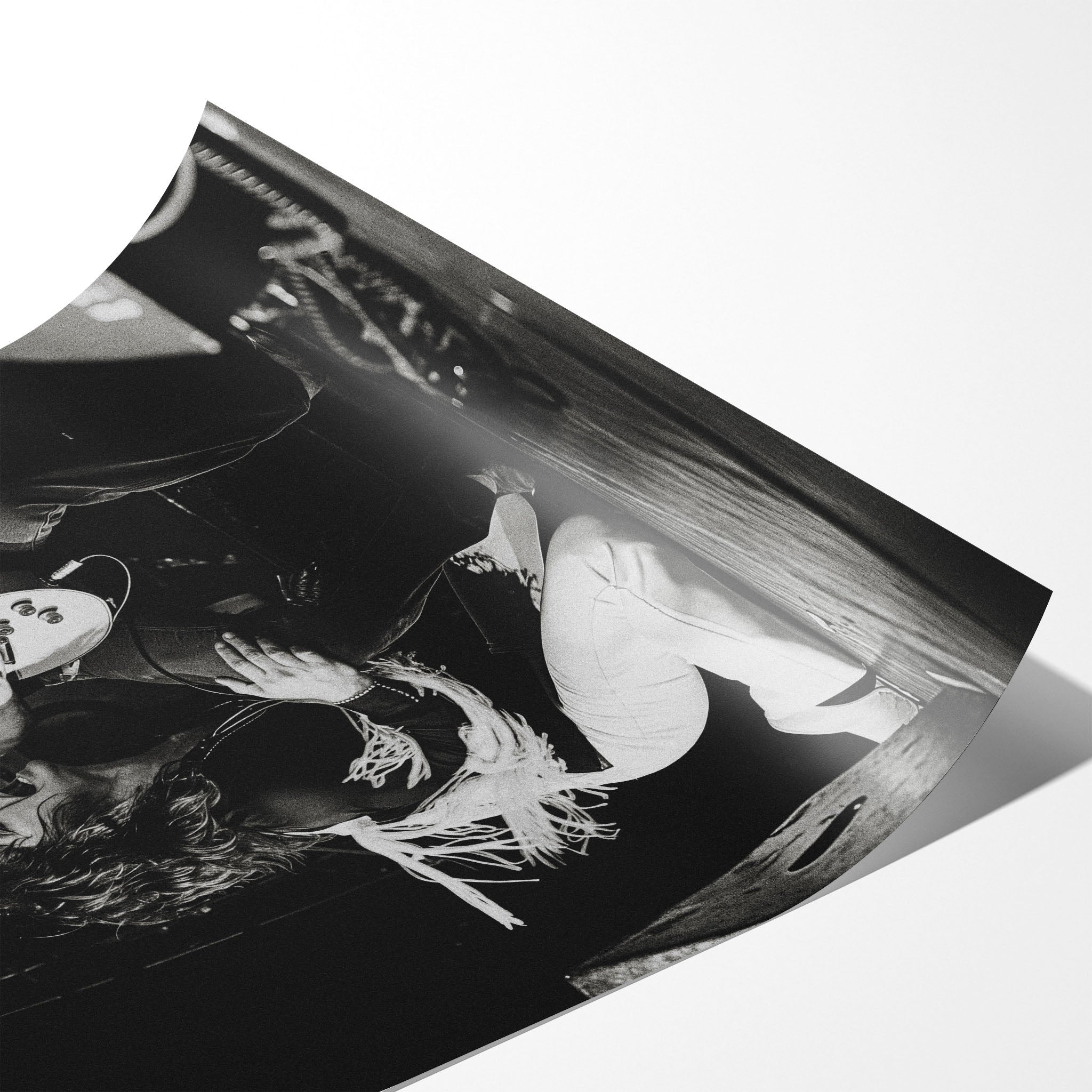 Angled close-up of the unframed Ozzy and Randy Rhoads black and white poster showing fine paper detail