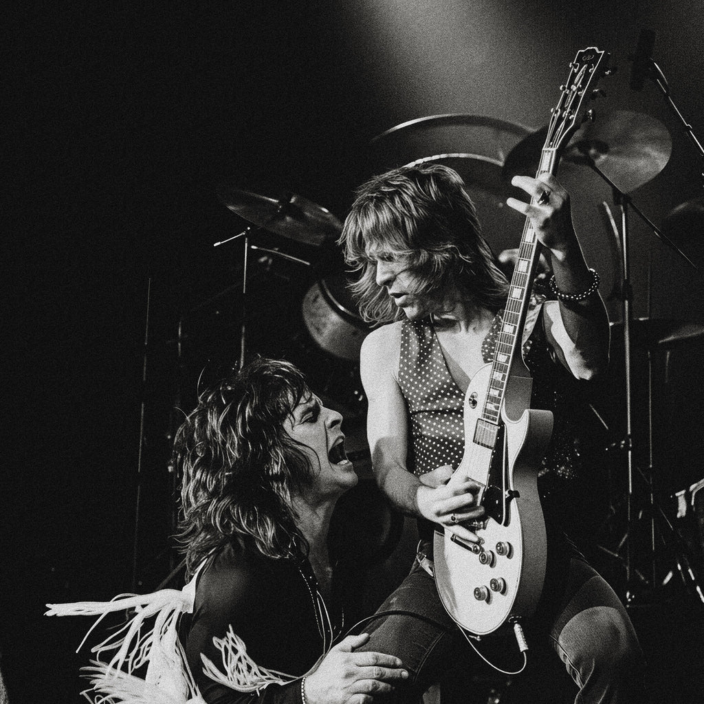Zoomed detail of Ozzy Osbourne and Randy Rhoads on stage in black and white, Bradford 1980