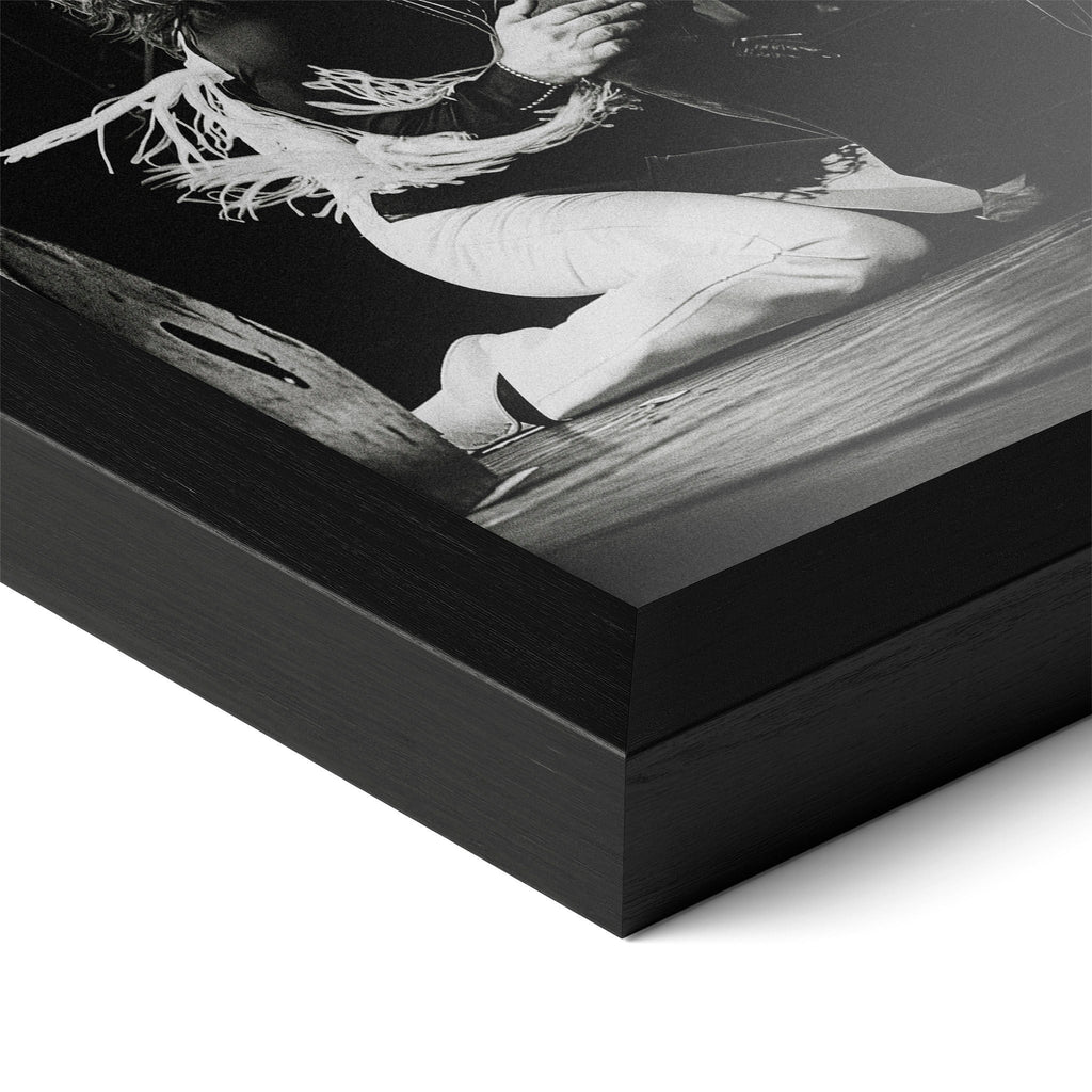 Close-up of the Ozzy and Randy Rhoads black and white poster in a classic black wood frame