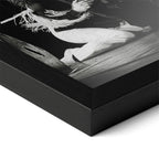 Close-up of the Ozzy and Randy Rhoads black and white poster in a classic black wood frame