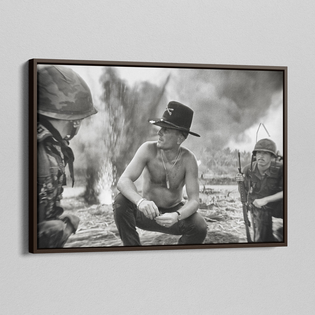 Angled view of the Apocalypse Now Kilgore black and white canvas in a dark walnut floating frame