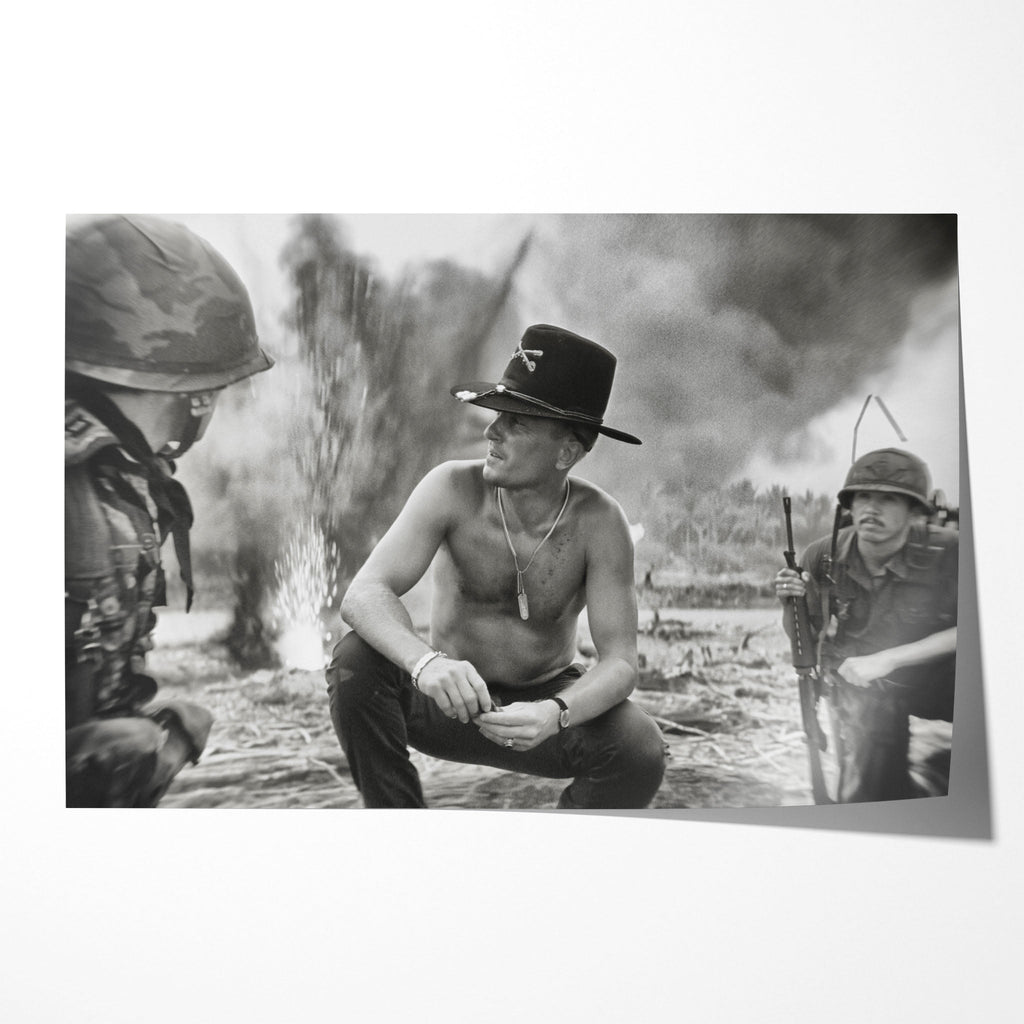 Unframed black and white print of Kilgore crouching on the beach amid napalm smoke in Apocalypse Now