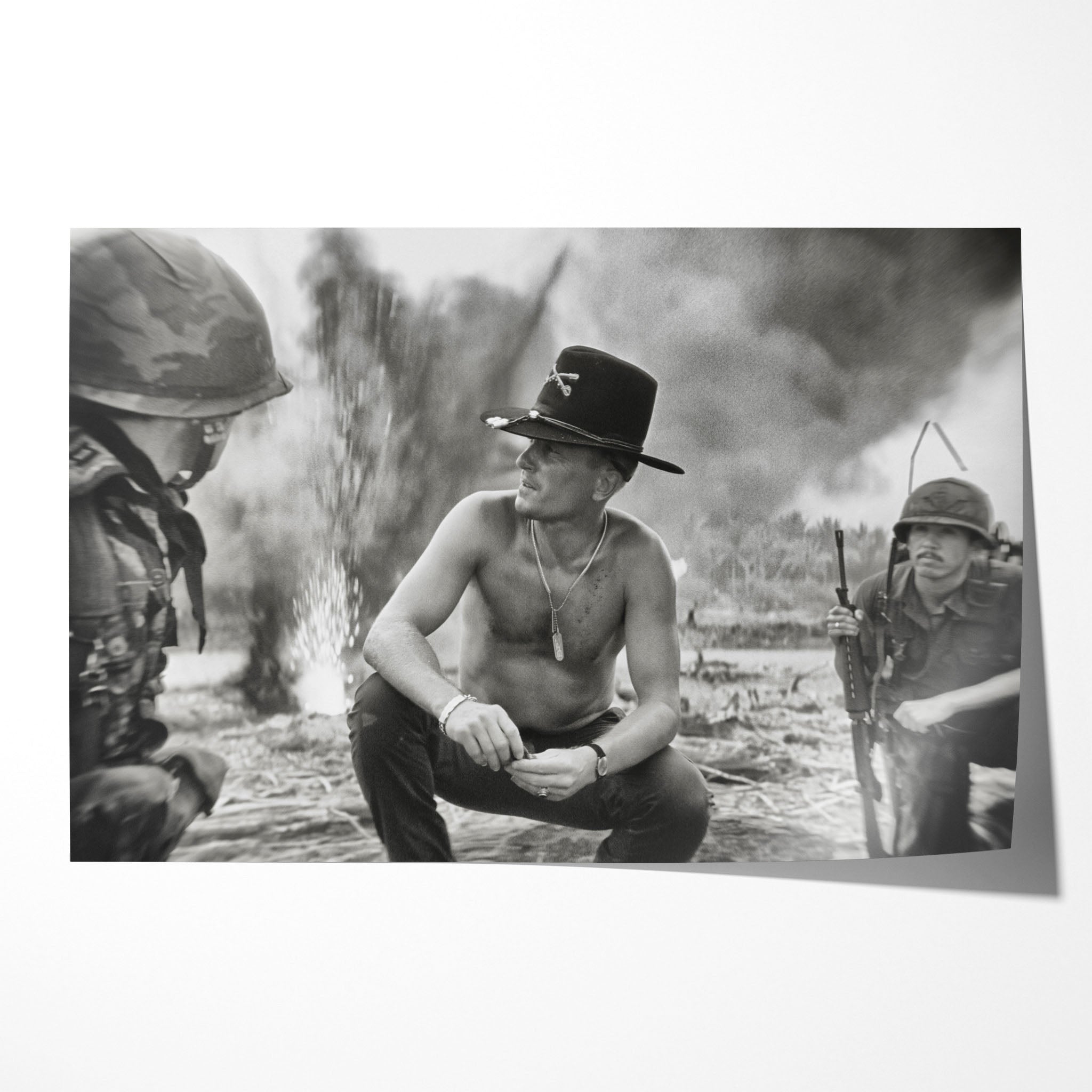 Unframed black and white print of Kilgore crouching on the beach amid napalm smoke in Apocalypse Now