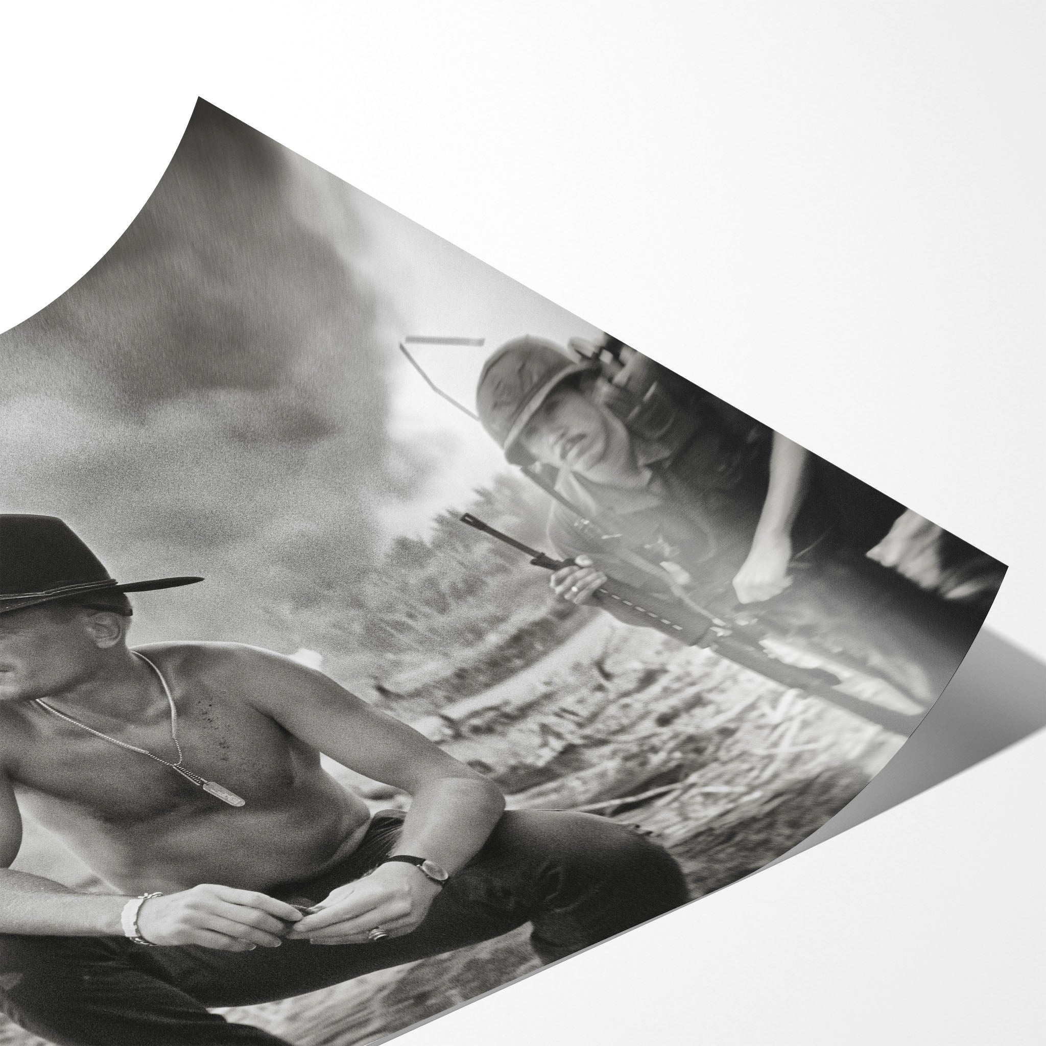 Angled close-up of the unframed Apocalypse Now Kilgore black and white poster showing fine paper detail