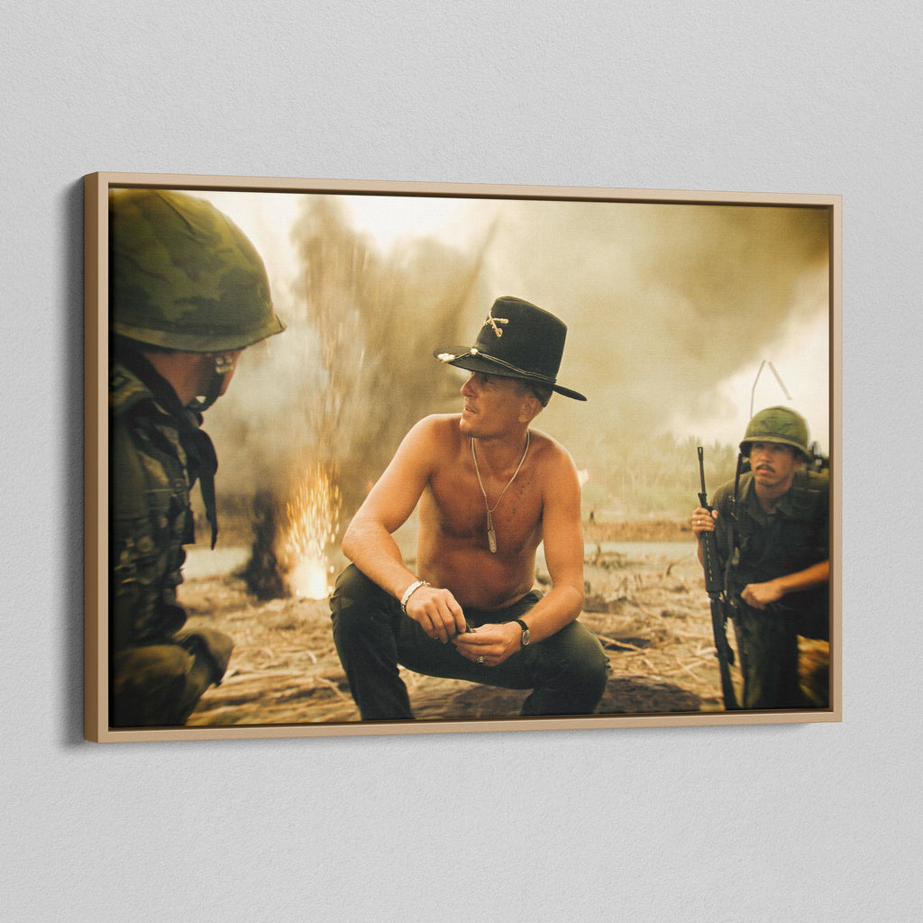 Angled view of the Apocalypse Now Kilgore colour canvas in a natural oak floating frame