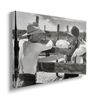 Gallery-wrapped black and white canvas of Gus and Call at the Hat Creek fence displayed on a wall