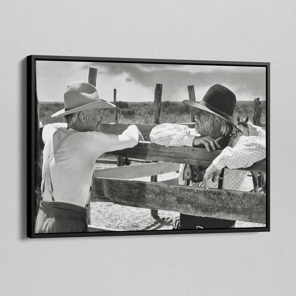 Angled view of the Lonesome Dove Hat Creek black and white canvas in a black floating frame
