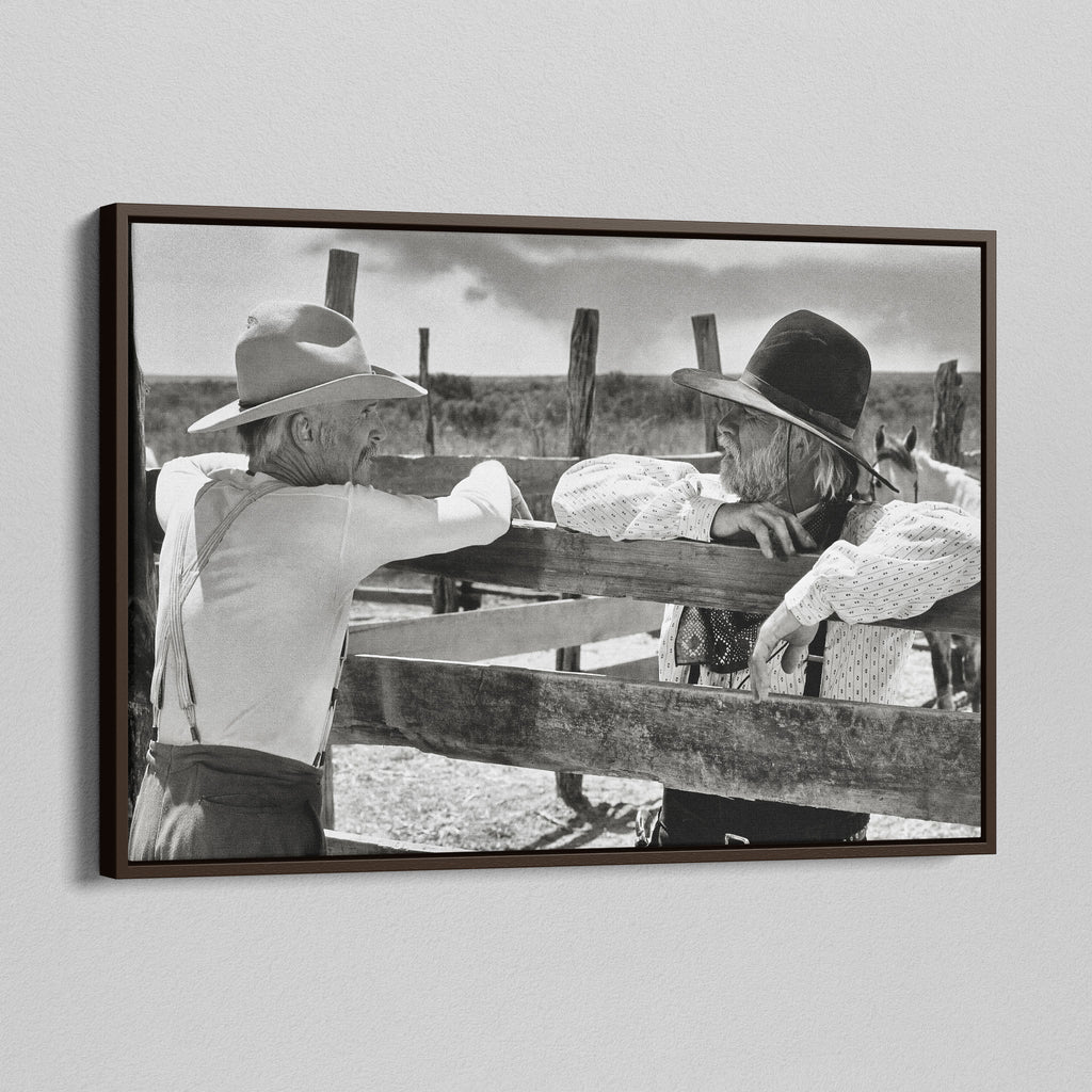Angled view of the Lonesome Dove Hat Creek black and white canvas in a dark walnut floating frame