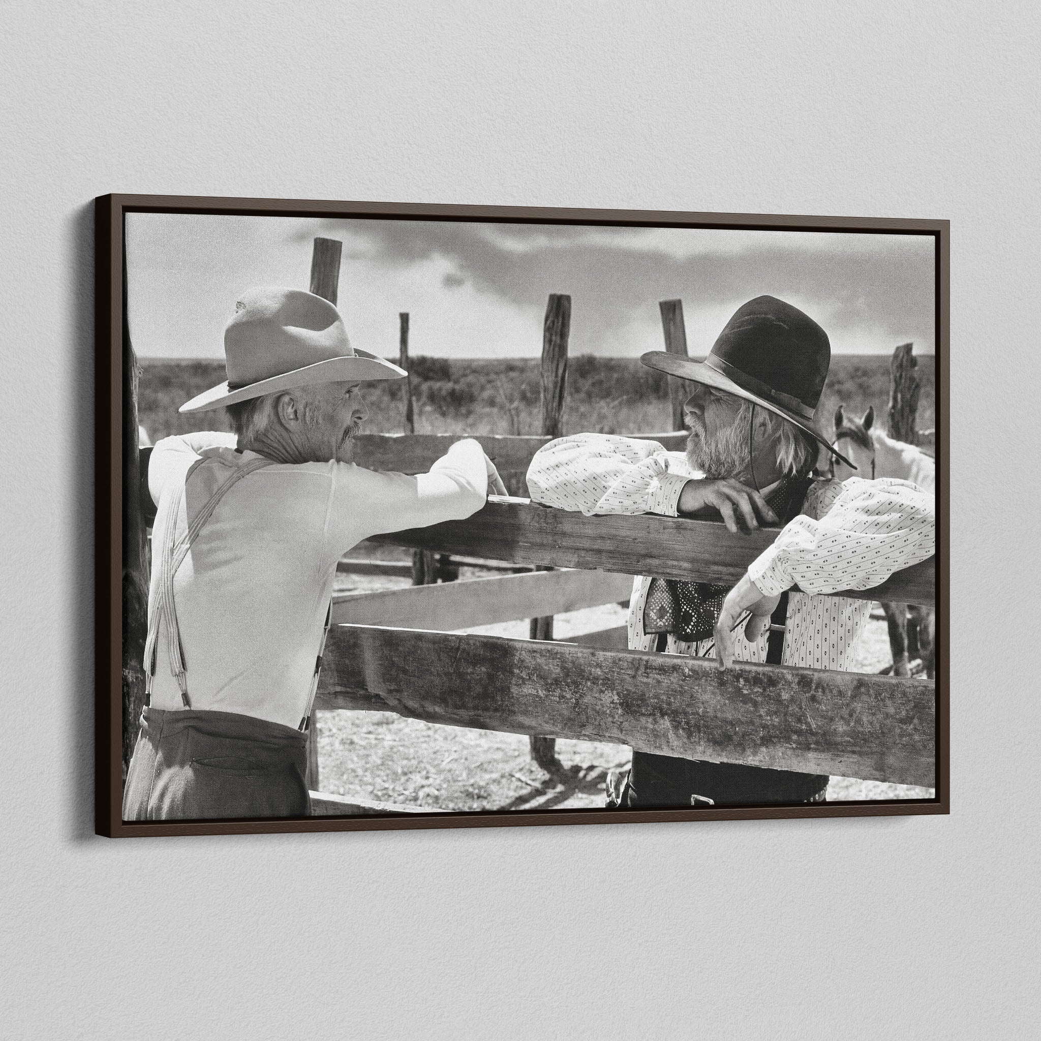 Angled view of the Lonesome Dove Hat Creek black and white canvas in a dark walnut floating frame