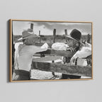 Angled view of the Lonesome Dove Hat Creek black and white canvas in a natural oak floating frame