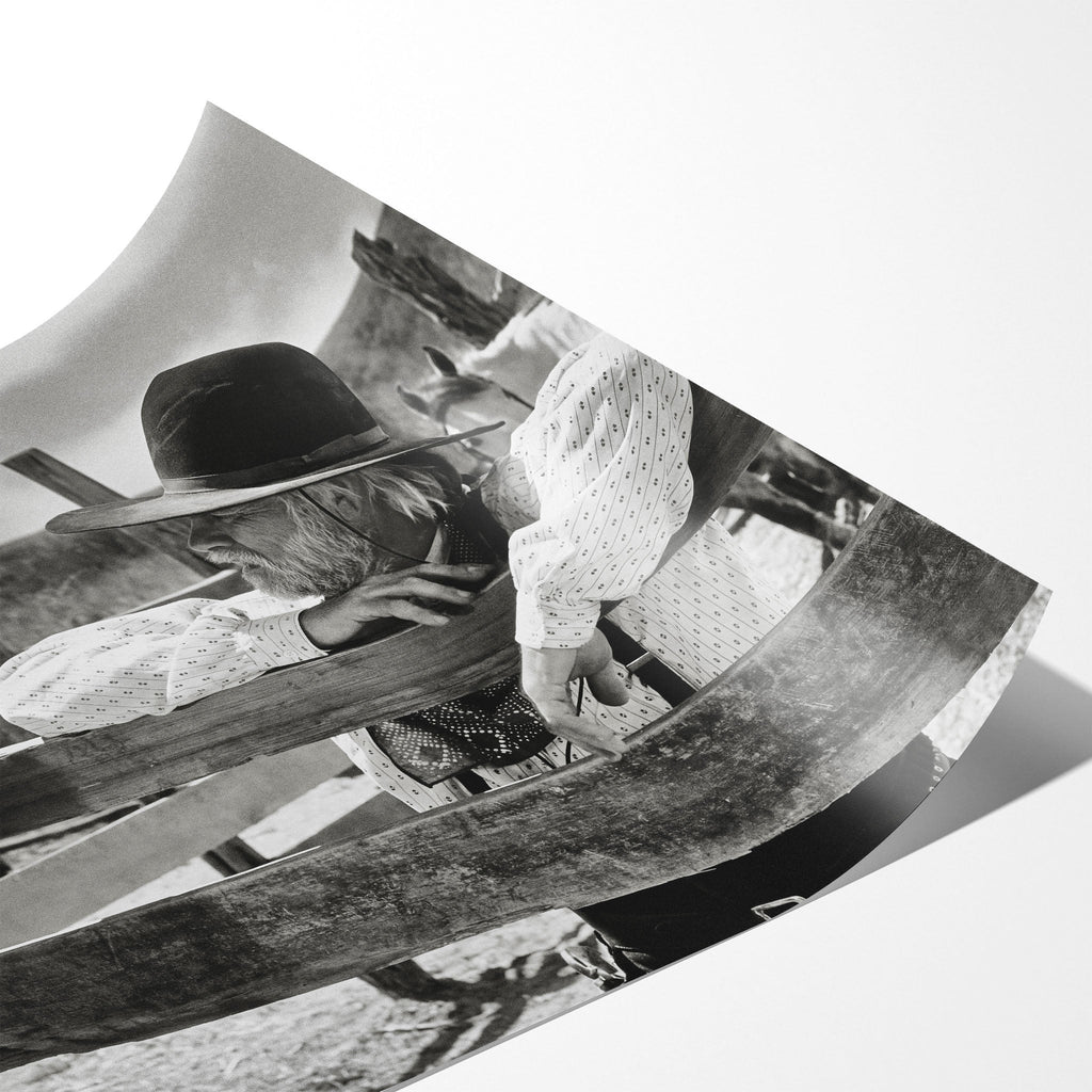 Angled close-up of the unframed Lonesome Dove Hat Creek black and white poster showing fine paper detail
