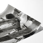 Angled close-up of the unframed Lonesome Dove Hat Creek black and white poster showing fine paper detail