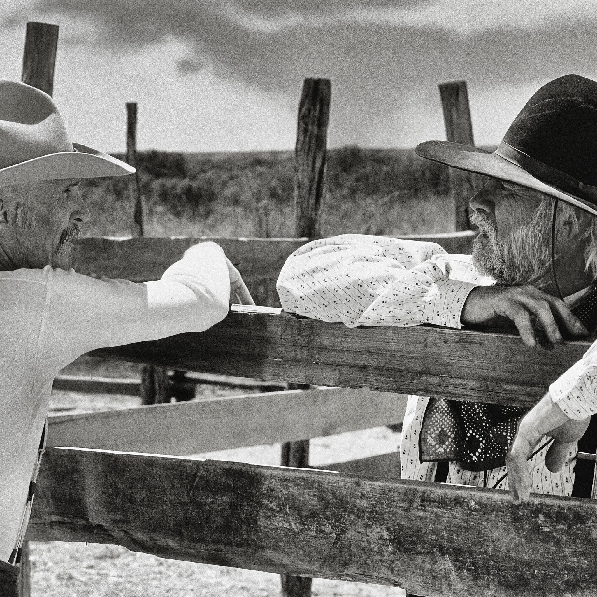 Zoomed detail of Robert Duvall as Gus and Tommy Lee Jones as Call in black and white
