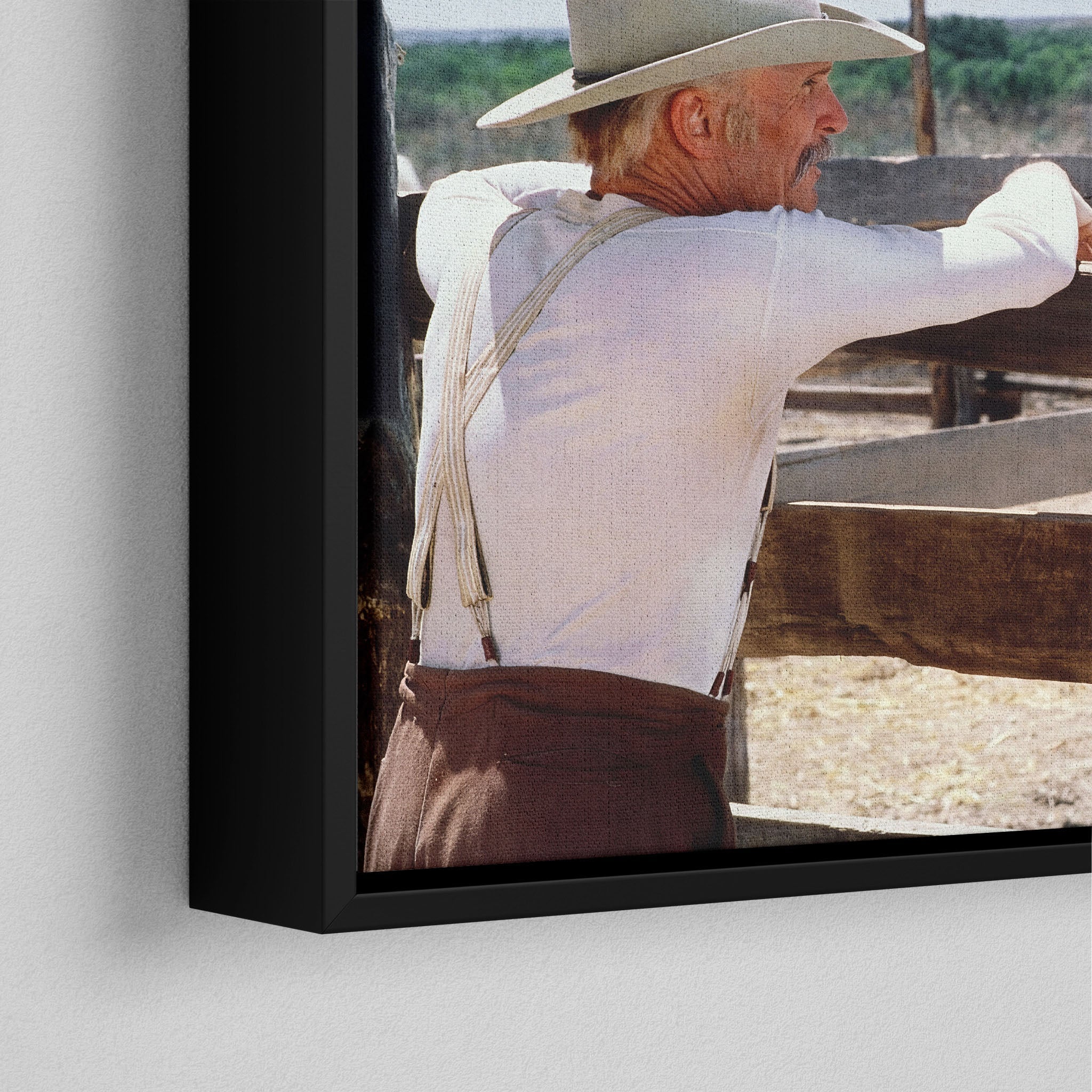 Corner close-up of the black floating frame on the Lonesome Dove Hat Creek colour canvas