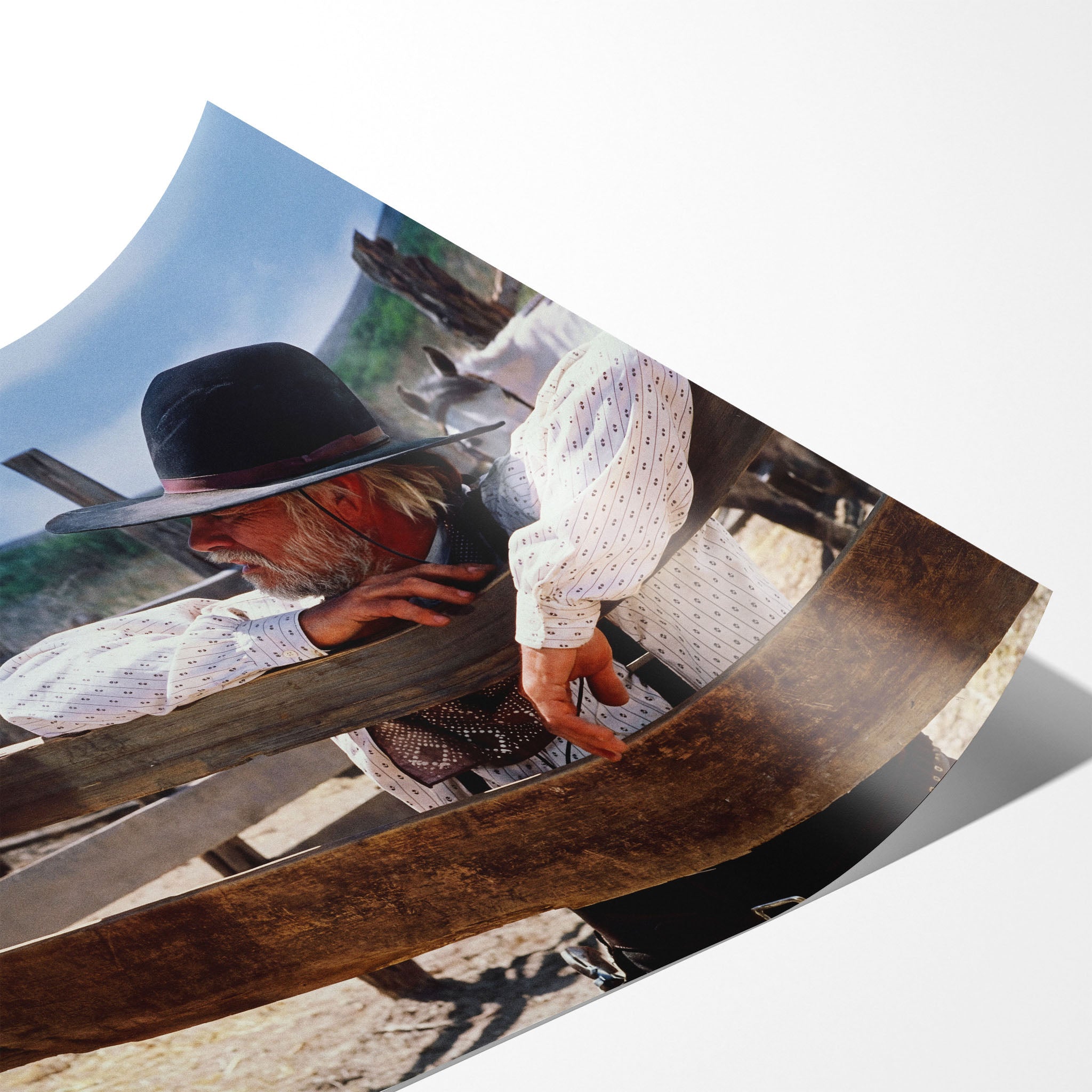 Angled close-up of the unframed Lonesome Dove Hat Creek colour poster showing fine paper detail