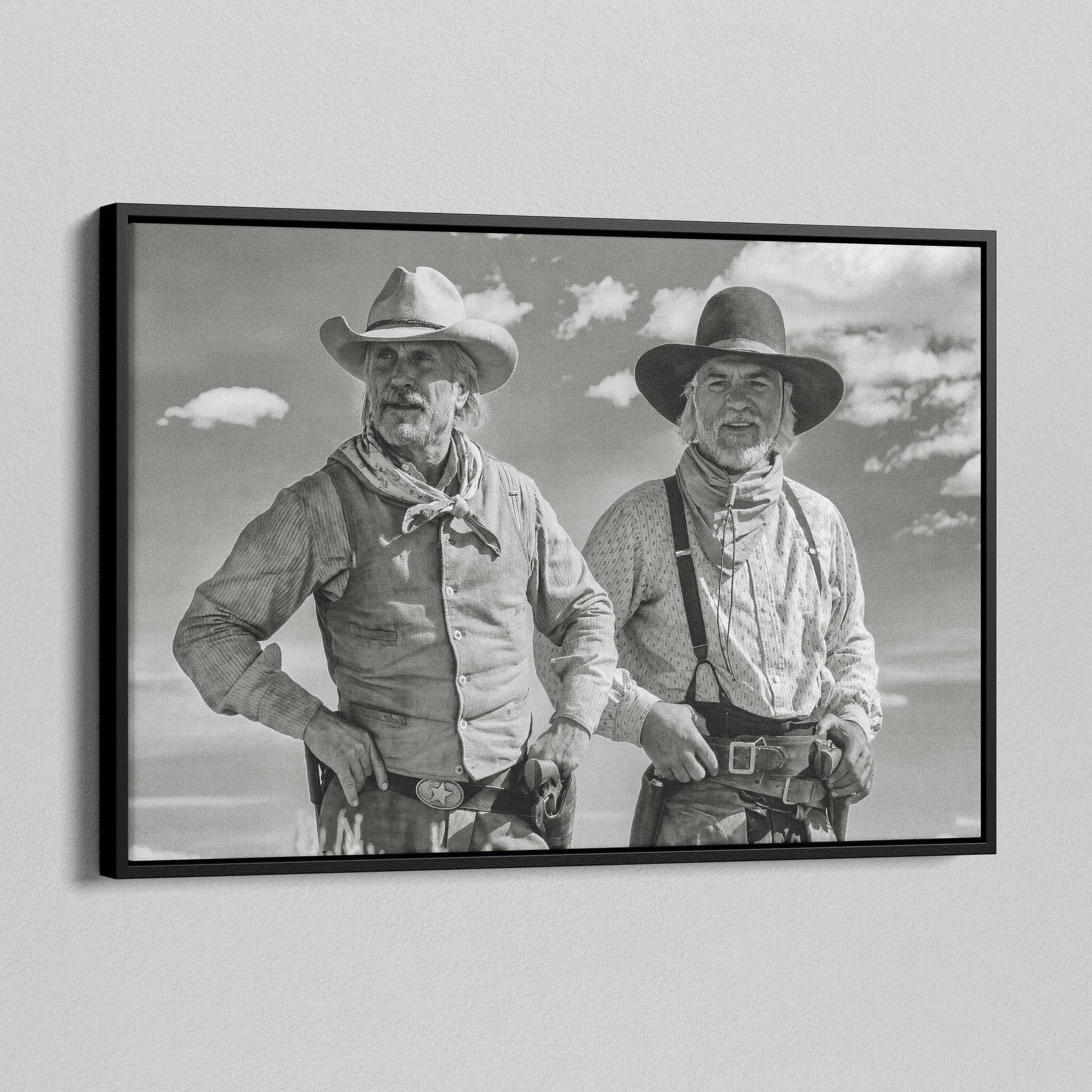 Angled view of the Lonesome Dove Montana Trail black and white canvas in a black floating frame
