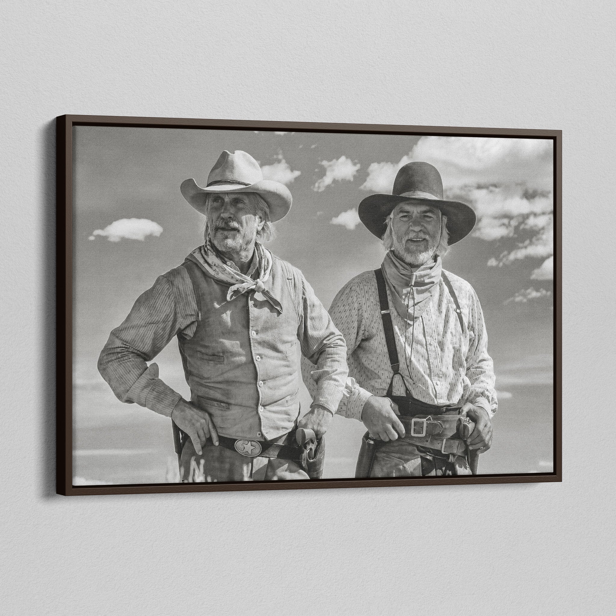 Angled view of the Lonesome Dove Montana Trail black and white canvas in a dark walnut floating frame