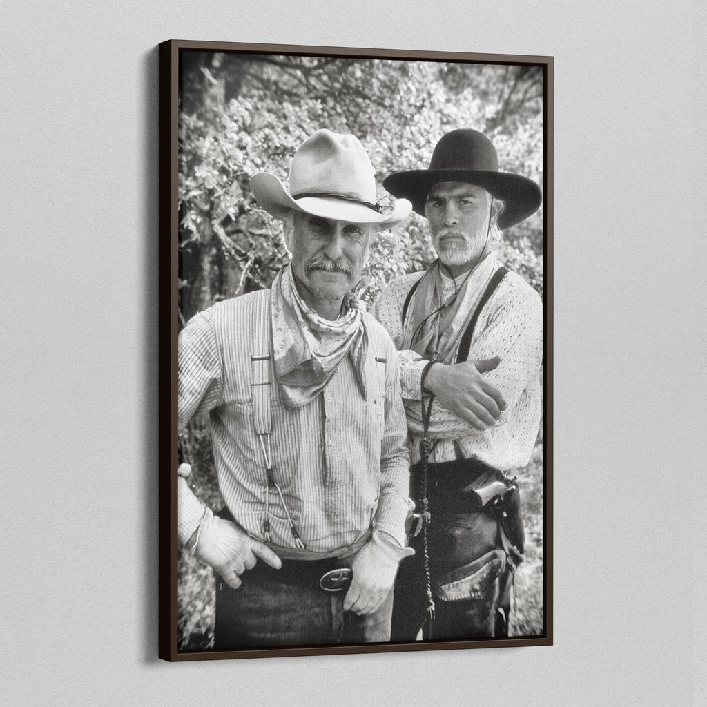 Angled view of the Lonesome Dove black and white canvas in a dark walnut floating frame