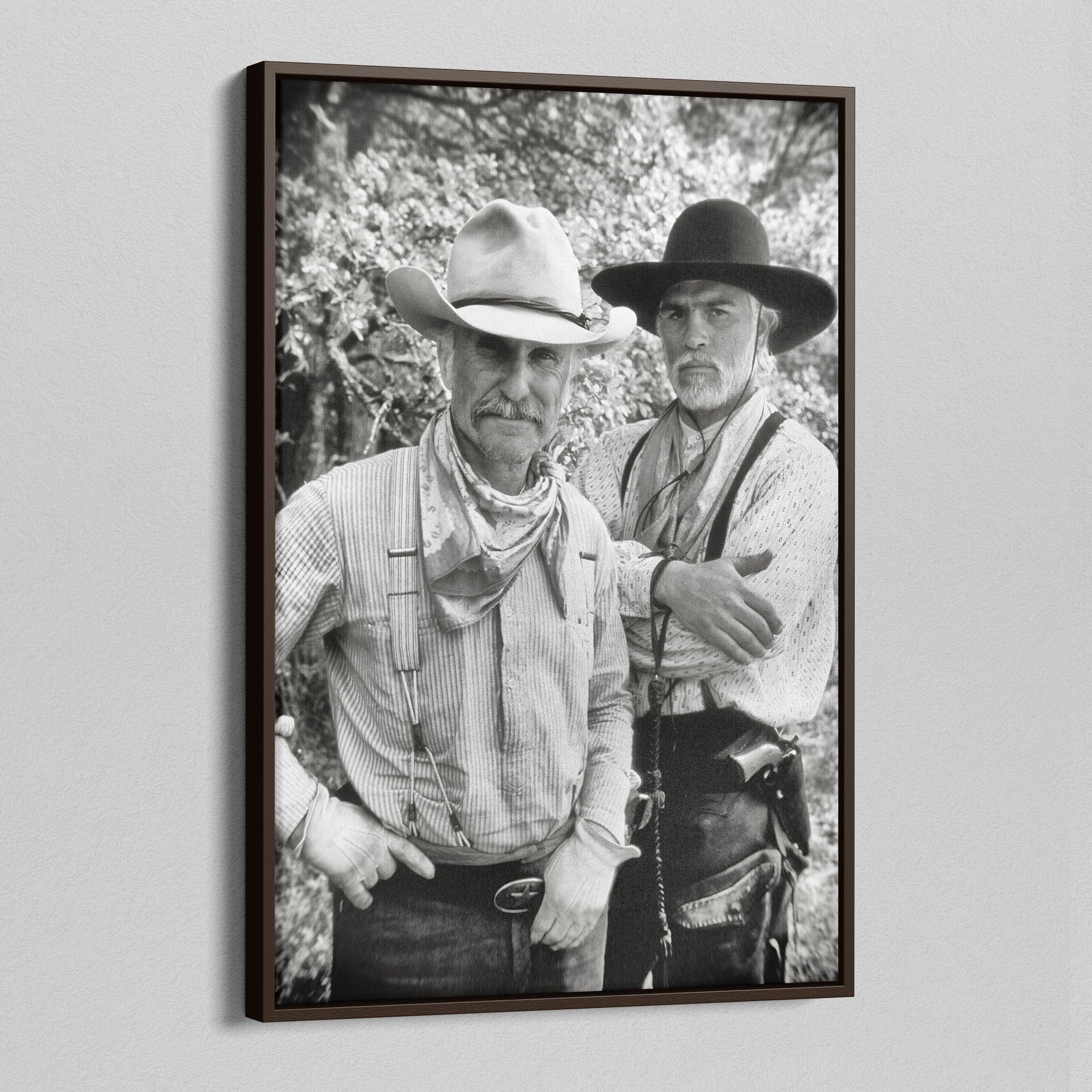 Angled view of the Lonesome Dove black and white canvas in a dark walnut floating frame