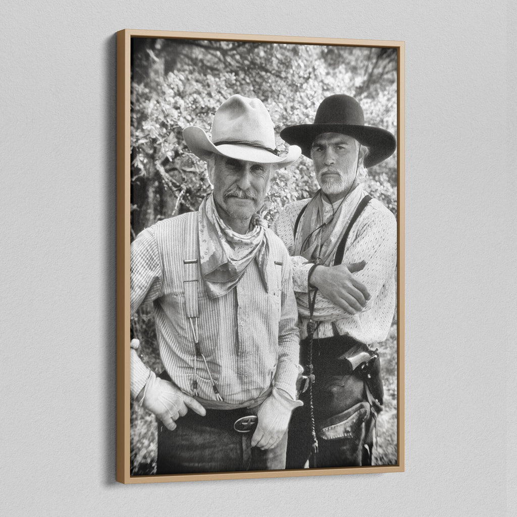 Angled view of the Lonesome Dove black and white canvas in a natural oak floating frame