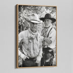 Angled view of the Lonesome Dove black and white canvas in a natural oak floating frame