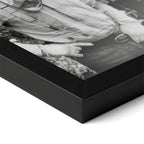Close-up of the Lonesome Dove black and white poster in a classic black wood frame