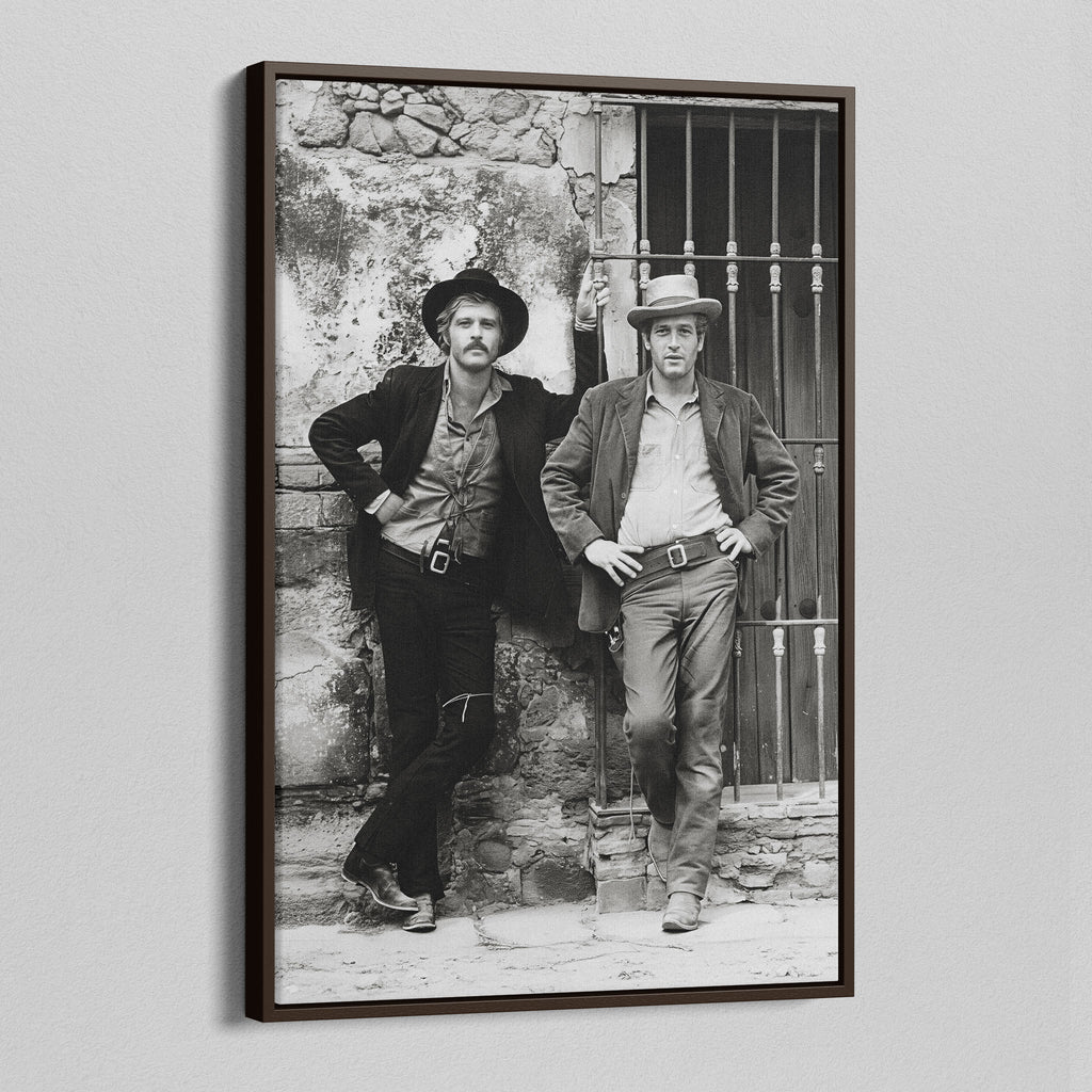 Angled view of the Butch Cassidy and the Sundance Kid black and white canvas in a dark walnut floating frame