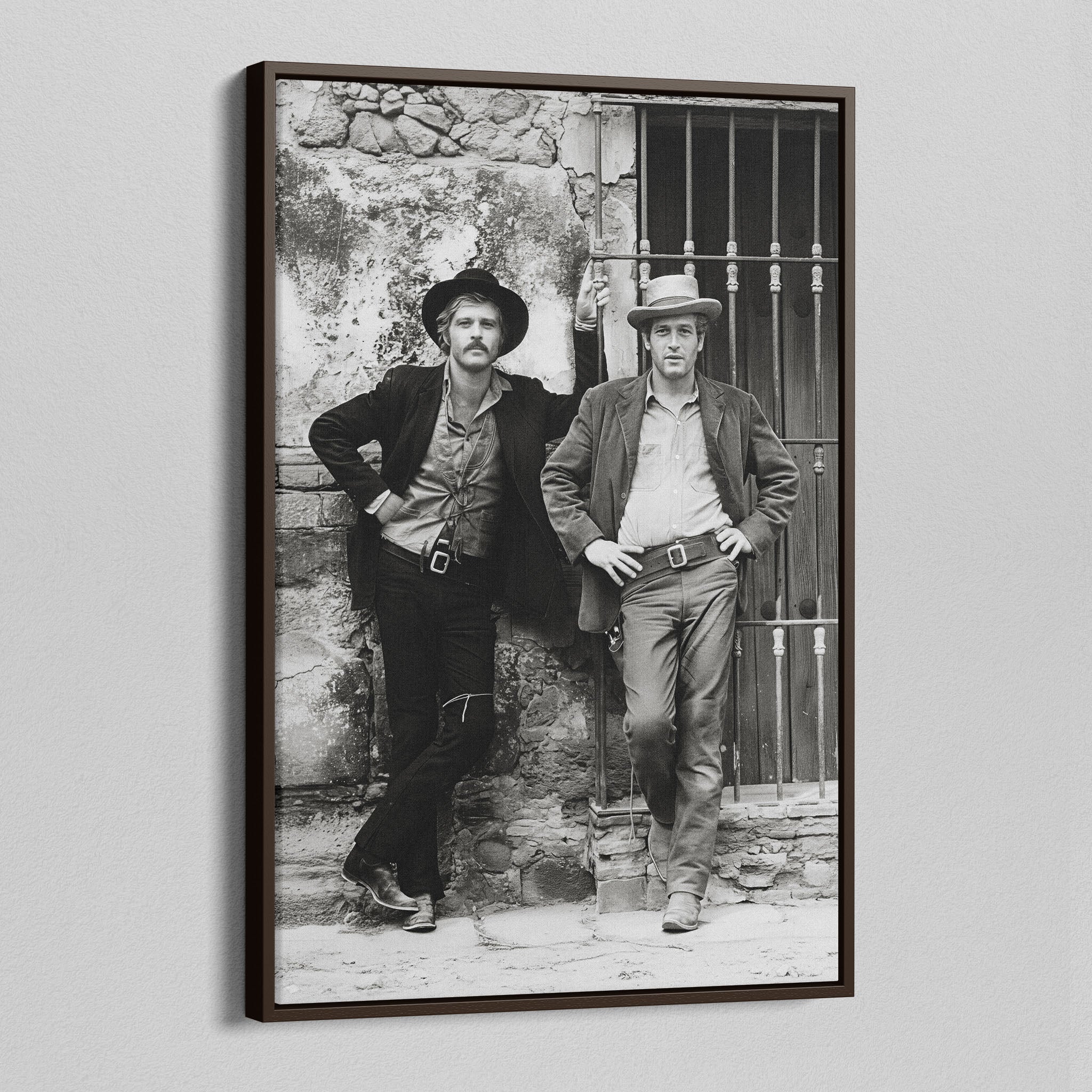 Angled view of the Butch Cassidy and the Sundance Kid black and white canvas in a dark walnut floating frame