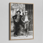 Angled view of the Butch Cassidy and the Sundance Kid black and white canvas in a natural oak floating frame