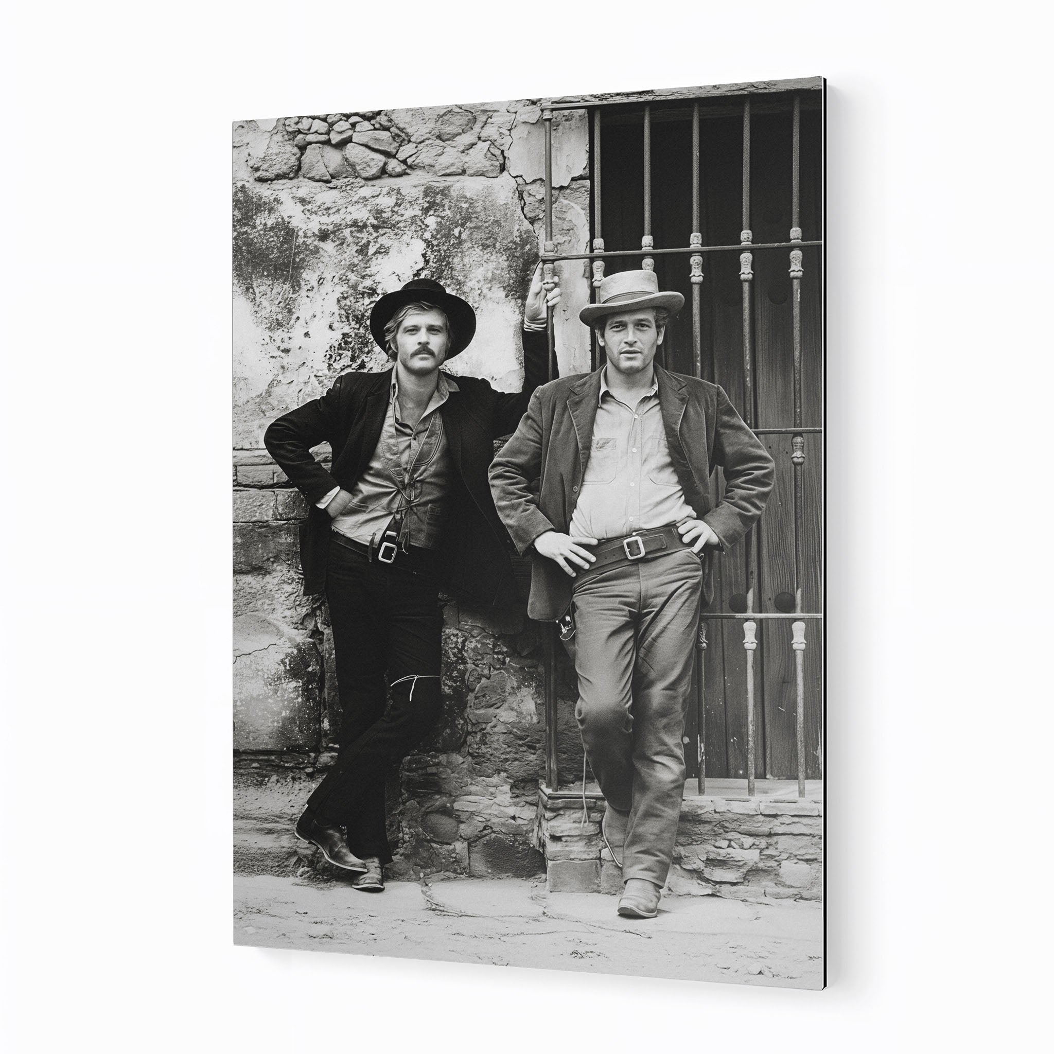 Butch Cassidy and the Sundance Kid black and white metal print displayed on a wall