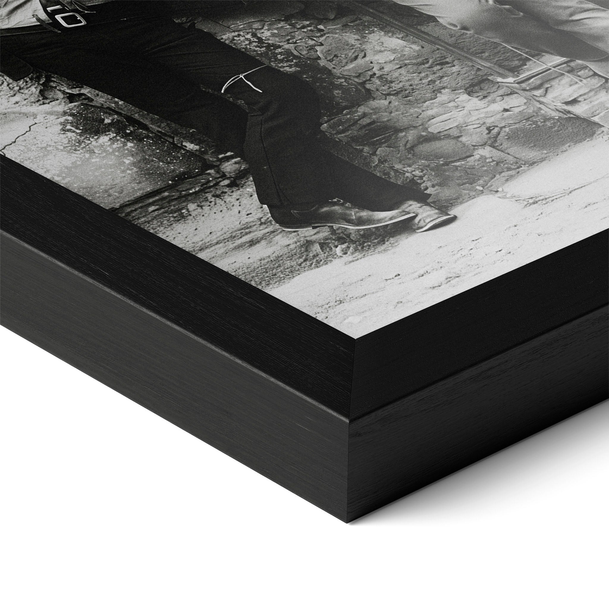 Close-up of the Butch Cassidy and the Sundance Kid black and white poster in a classic black wood frame