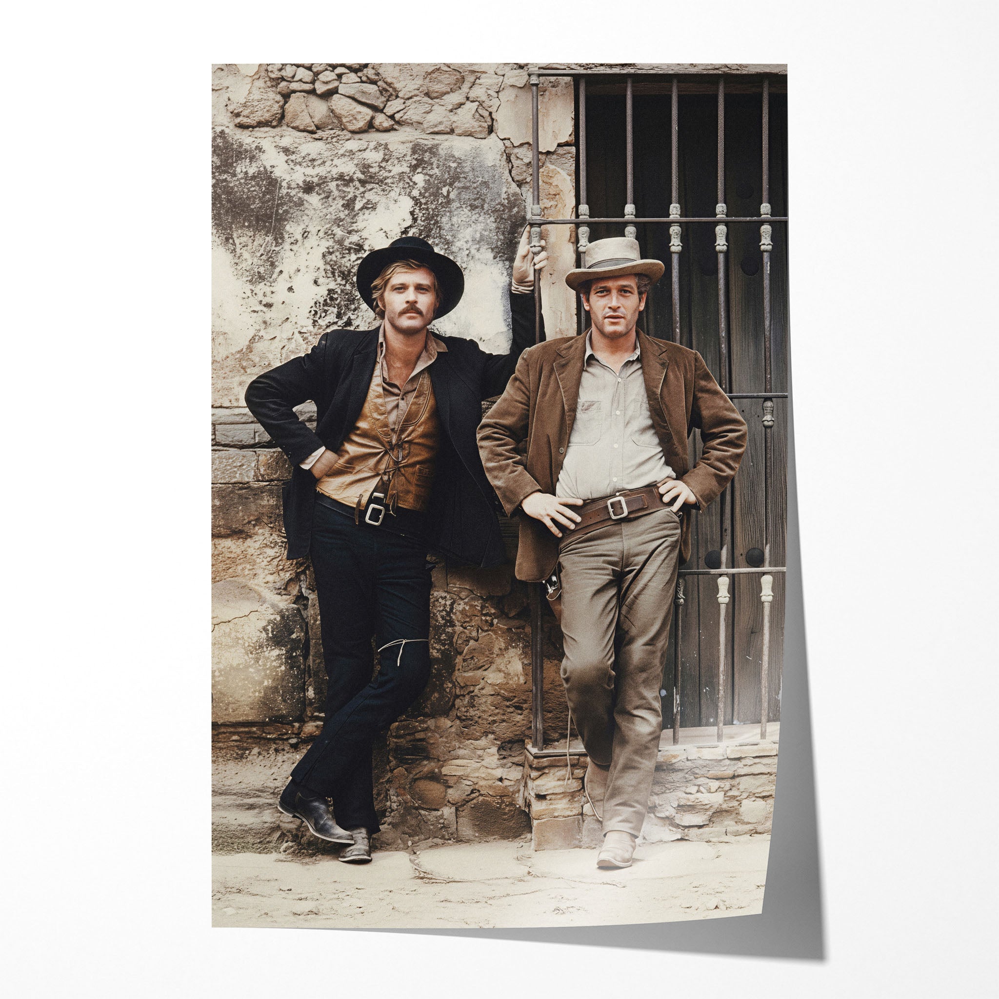 Unframed colour print of Butch Cassidy and the Sundance Kid leaning against a stone wall