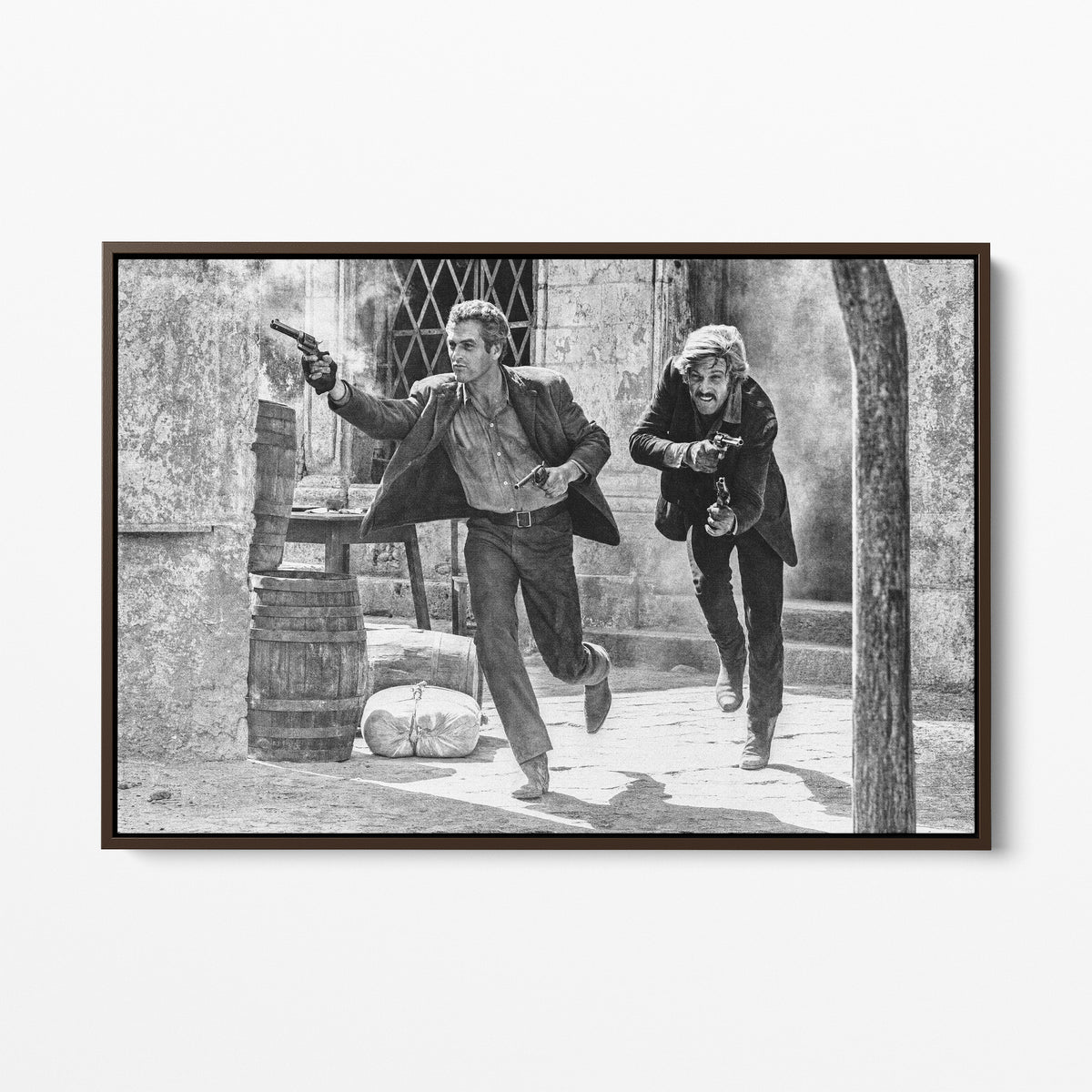 Front display of the Butch Cassidy and the Sundance Kid final shootout black and white canvas in a dark walnut floating frame