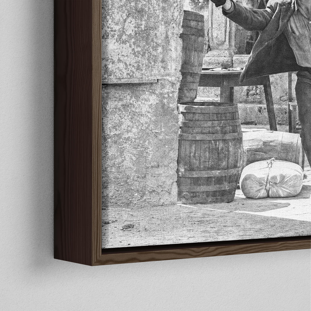 Close-up of the dark walnut floating frame on the Butch Cassidy and the Sundance Kid final shootout black and white canvas