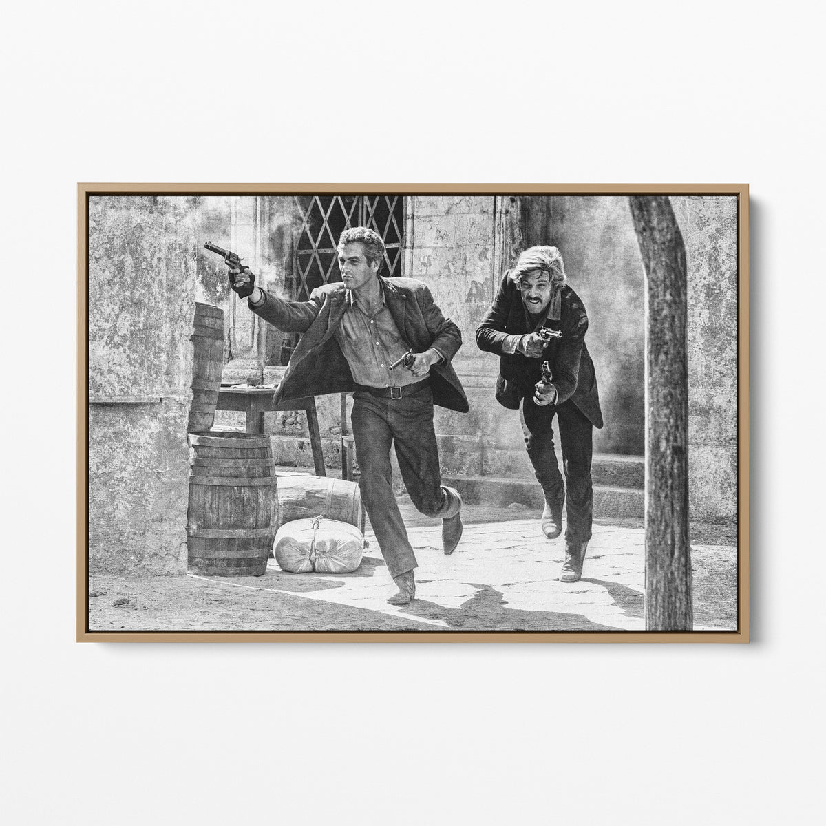 Front display of the Butch Cassidy and the Sundance Kid final shootout black and white canvas in a natural oak floating frame