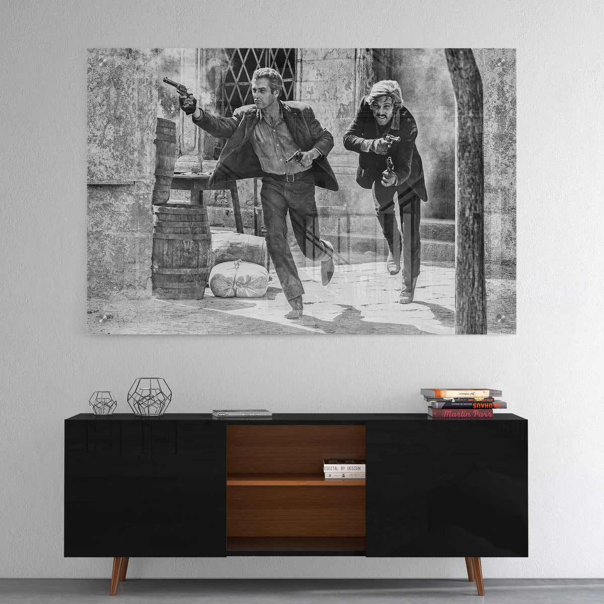 High-gloss acrylic black and white print of the Butch Cassidy and the Sundance Kid final shootout displayed on a wall