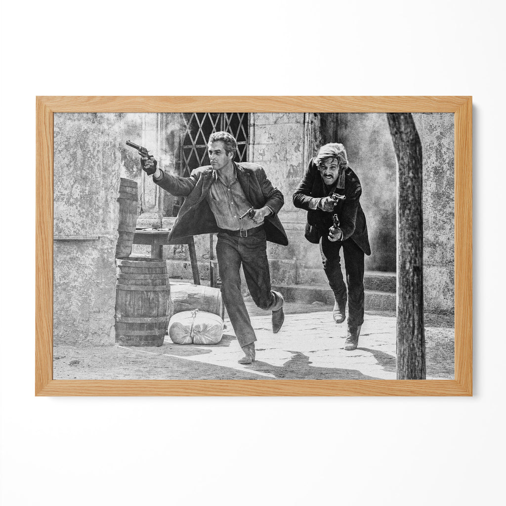 Butch Cassidy and the Sundance Kid final shootout black and white print in a natural oak poster frame