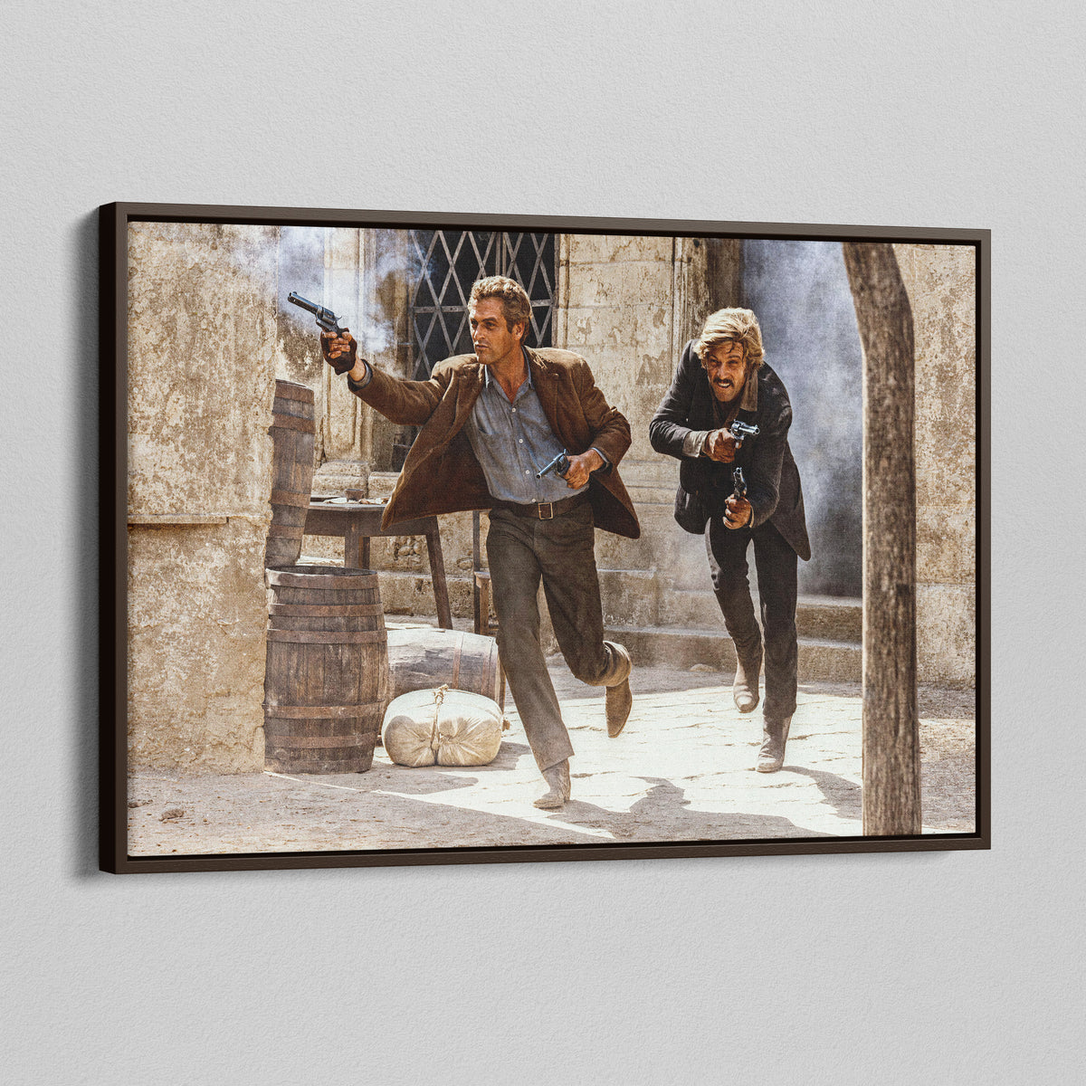 Angled view of the Butch Cassidy and the Sundance Kid final shootout color canvas in a dark walnut floating frame