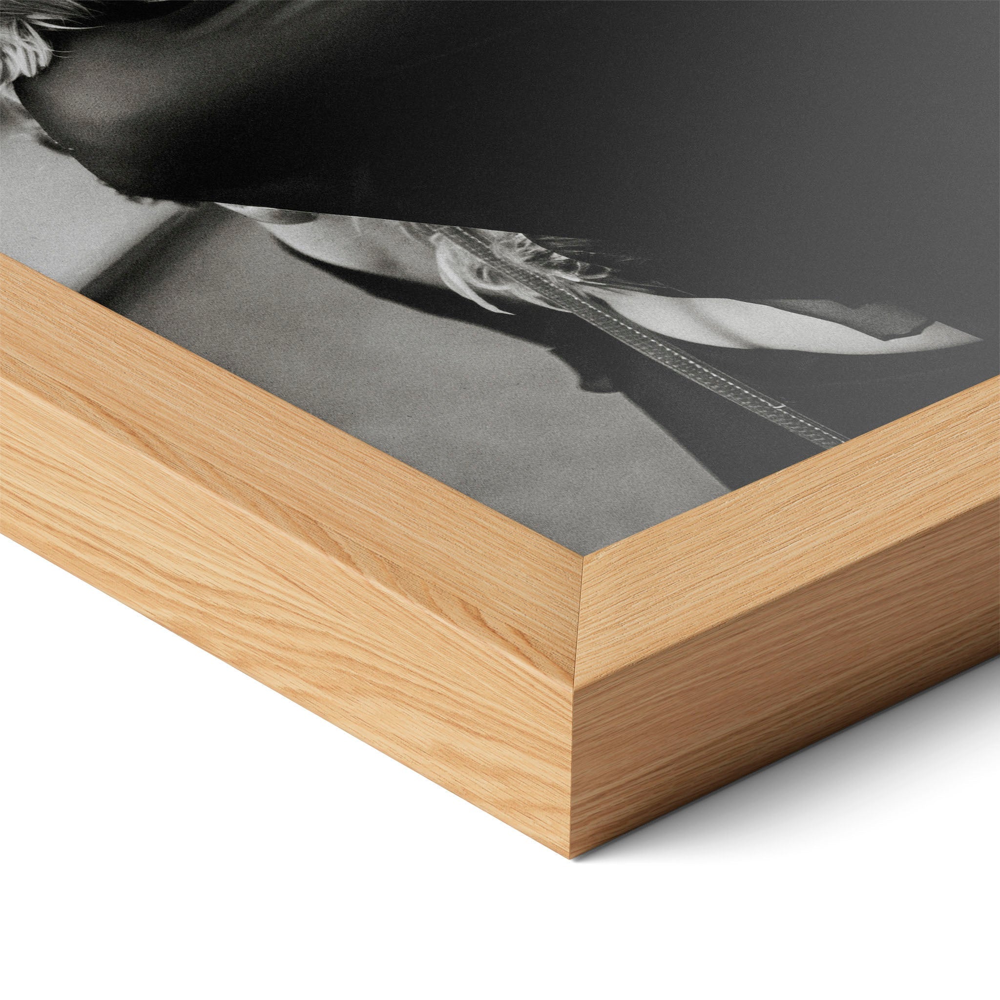 Corner close-up of the Stevie Nicks black and white portrait in a natural oak frame