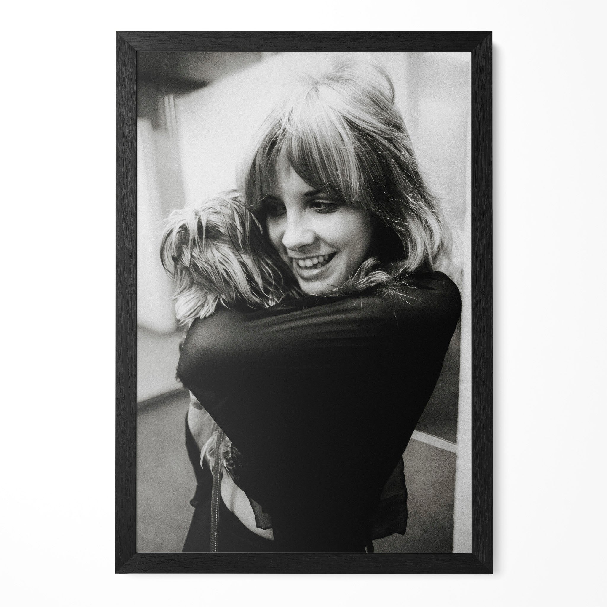 Stevie Nicks black and white candid portrait cuddling her dog in a classic black poster frame