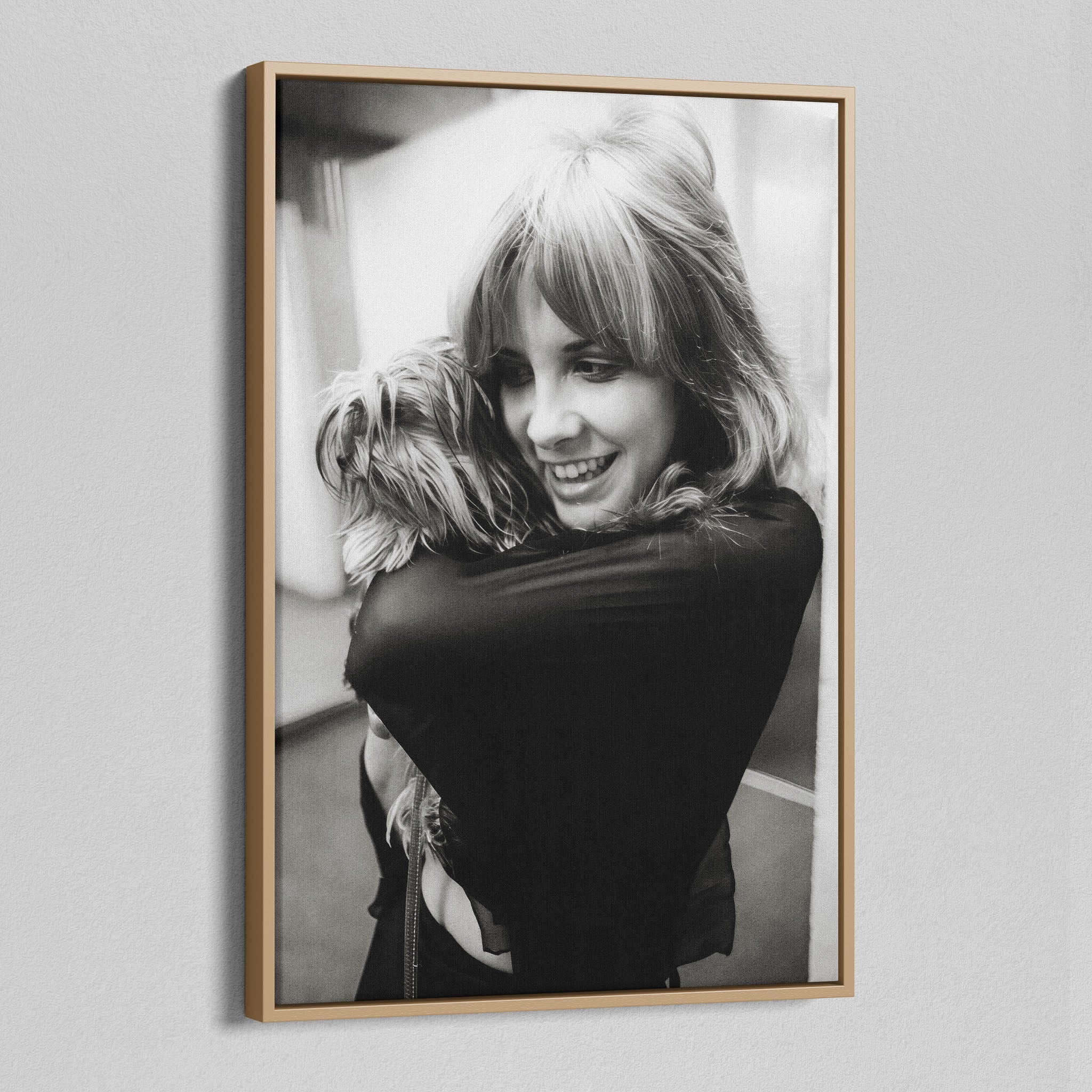 Angled view of the Stevie Nicks black and white portrait canvas in a natural oak floating frame