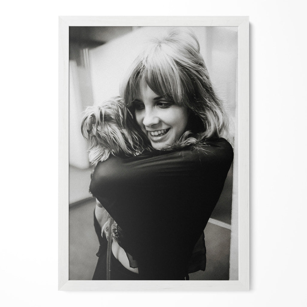 Stevie Nicks black and white candid portrait with her dog in a classic white poster frame