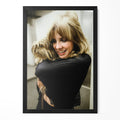 Stevie Nicks candid colour portrait cuddling her dog in a classic black poster frame