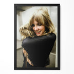 Stevie Nicks candid colour portrait cuddling her dog in a classic black poster frame