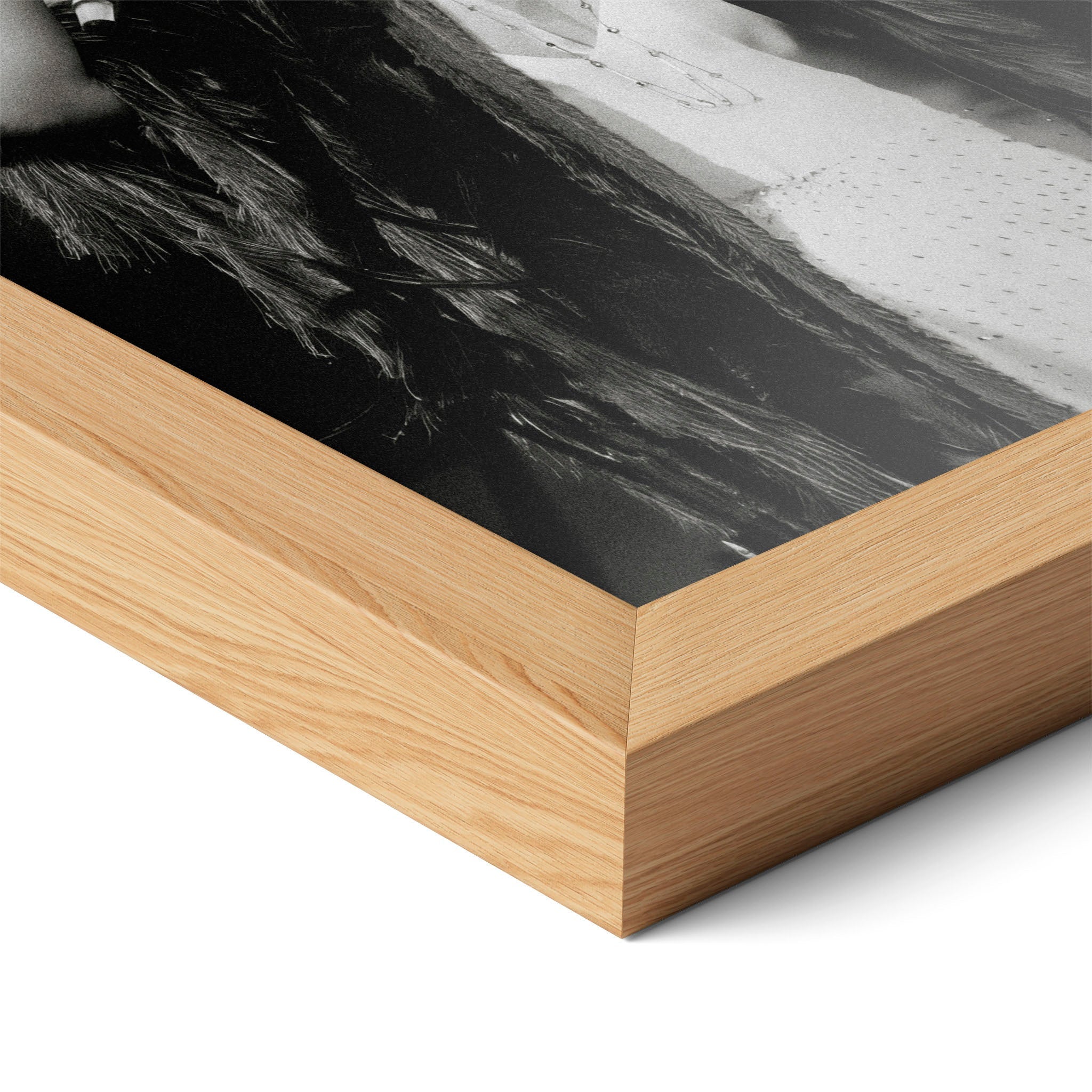 Corner close-up of the Stevie Nicks 1970s live black and white poster in a natural oak frame