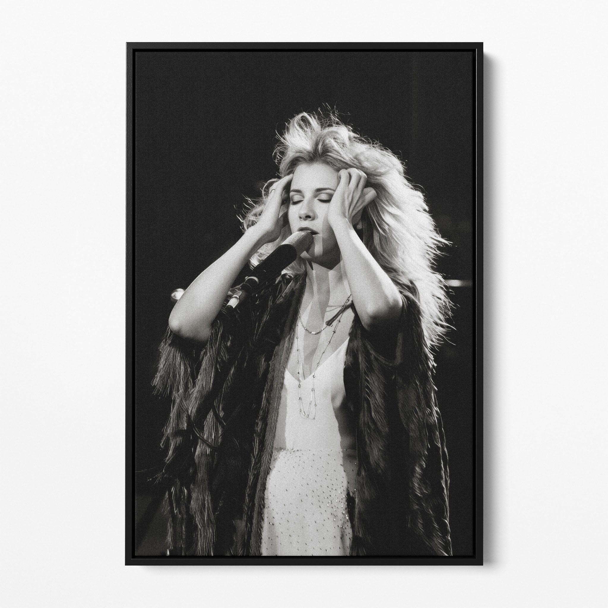 Front view of the Stevie Nicks 1970s live black and white canvas in a black floating frame