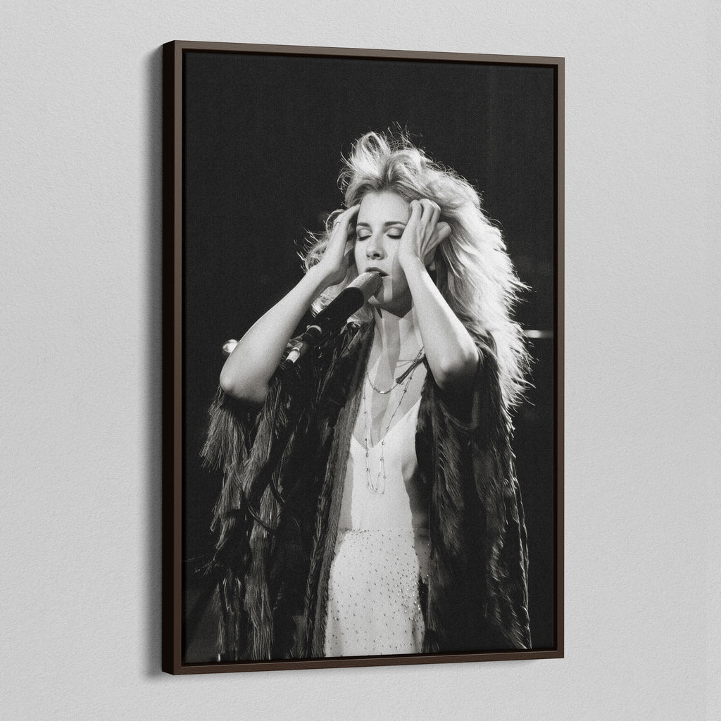 Angled view of the Stevie Nicks 1970s live black and white canvas in a dark walnut floating frame