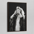 Angled view of the Stevie Nicks 1970s live black and white canvas in a dark walnut floating frame