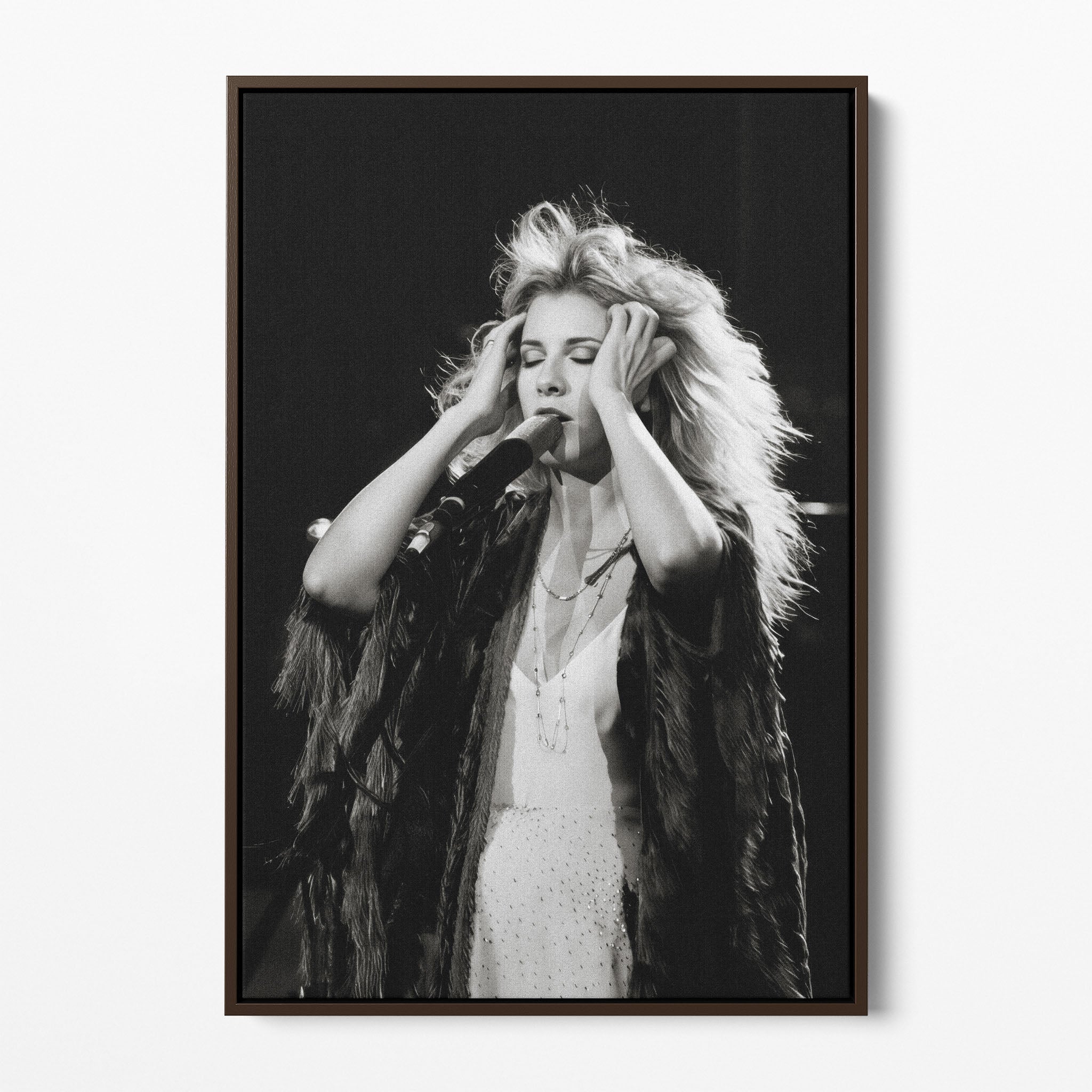 Front view of the Stevie Nicks 1970s live black and white canvas in a dark walnut floating frame