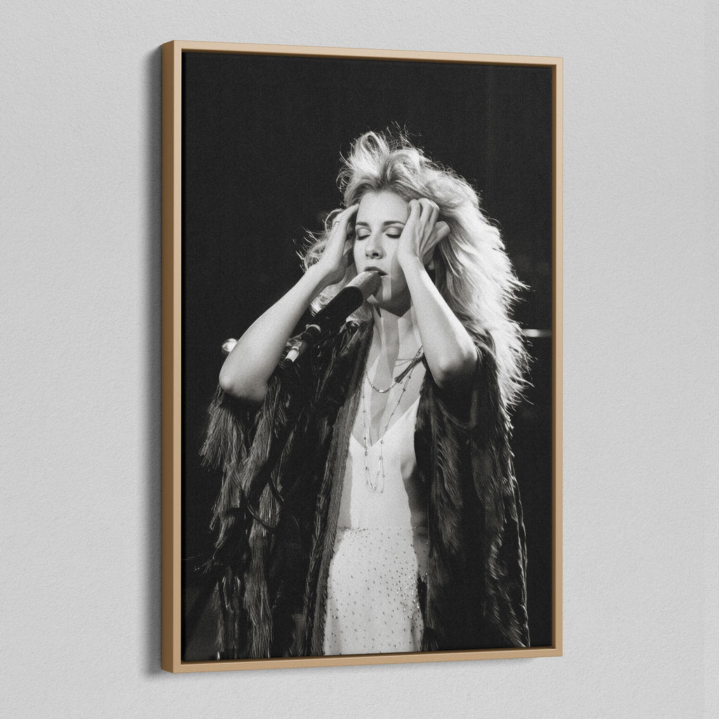 Angled view of the Stevie Nicks 1970s live black and white canvas in a natural oak floating frame